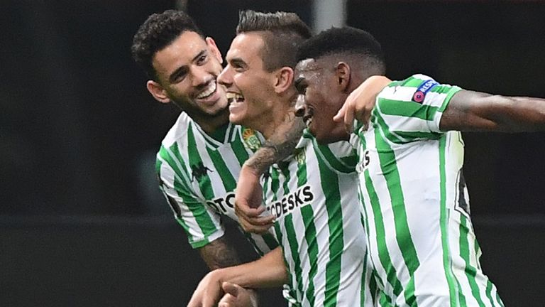 Real Betis' Argentine midfielder Giovani Lo Celso (C) celebrates with Real Betis' Paraguayan forward Arnaldo Sanabria (L) 