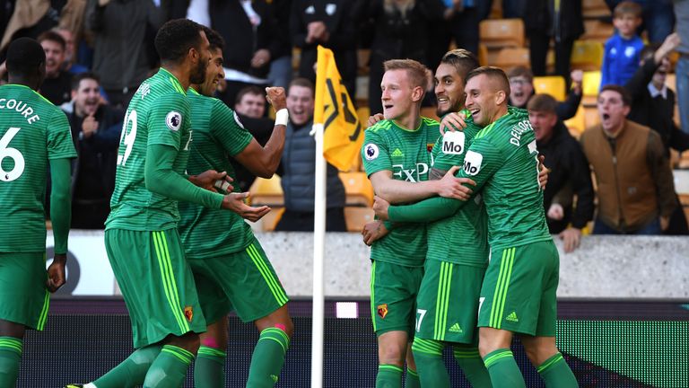 Roberto Pereyra celebrates with team-mates after scoring Watford's second goal