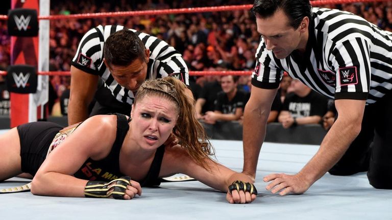 ronda rousey left in ring after attack from bella twins