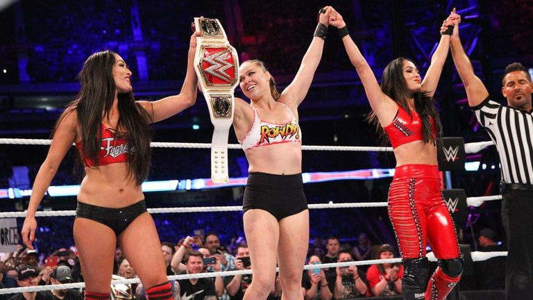 Ronda Rousey remains unbeaten in WWE after joining forces with the Bella Twins to beat the Riott Squad