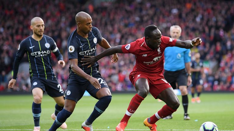 Sadio Mane looks to retain possession under pressure from Fernandinho