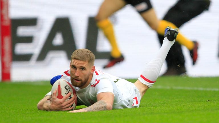 Sam Tomkins crosses for England's first try of the match