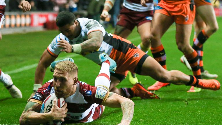 Wigan's Sam Tomkins scores a try.