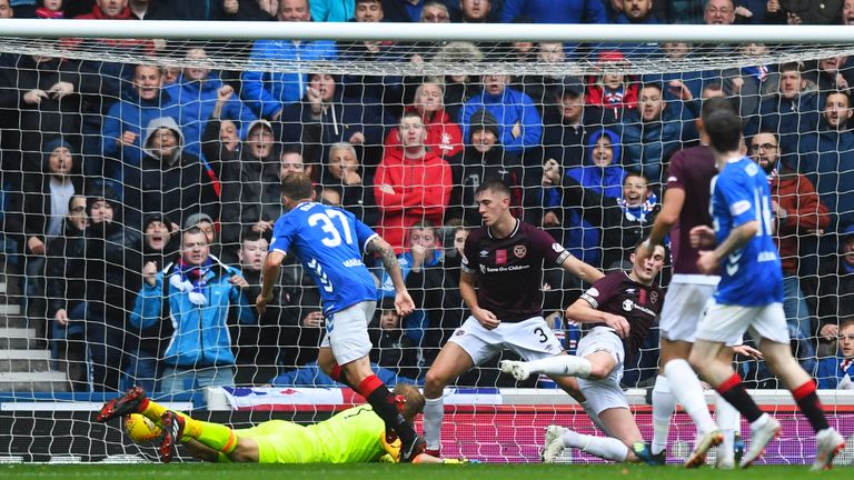 Scott Arfield pounces on a loose ball to crash home a third before half-time