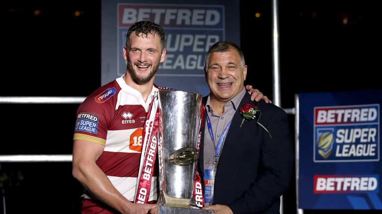 Wigan Warriors' Sean O'Loughlin (left) and head coach Shaun Wane (right) celebrate with the trophy after the Super League Grand Final at Old Trafford