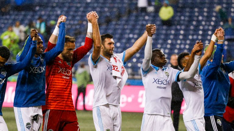 Oct 8, 2018; Seattle, WA, USA; Seattle Sounders FC players including goalkeeper Stefan Frei (second from left) and forward Will Bruin (17) and defender Nouhou Tolo (5) bow to fans following a 4-1 victory against the Houston Dynamo at CenturyLink Field. Mandatory Credit: Joe Nicholson-USA TODAY Sports