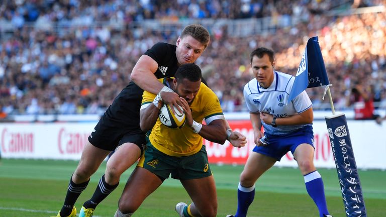 Sefa Naivalu on the way to scoring his try that put Australia firmly in the mix at half-time