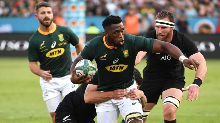 Siya Kolisi of the Springboks tackled by Ryan Crotty 