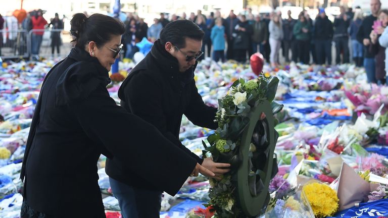 Aiyawatt and Aimon, son and wife of the owner of Leicester City, Vichai Srivaddhanaprabha, pay tribute and do a floral tribute outside the club's King Power Stadium.