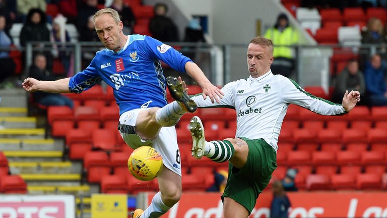 St Johnstone defender Steven Anderson (left) tries to clear the ball from Celtic striker Leigh Griffiths