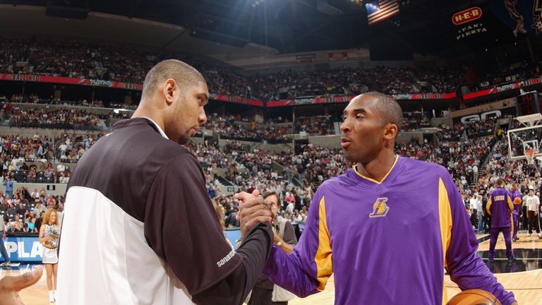 Kobe Bryant #8 of the Los Angeles Lakers greets Tim Duncan #21 of the San Antonio Spurs before Game five of the Western Conference Semifinals during the 2003 NBA Playoffs at SBC Center on May 13, 2003 in San Antonio, Texas. The Spurs won 96-94. 