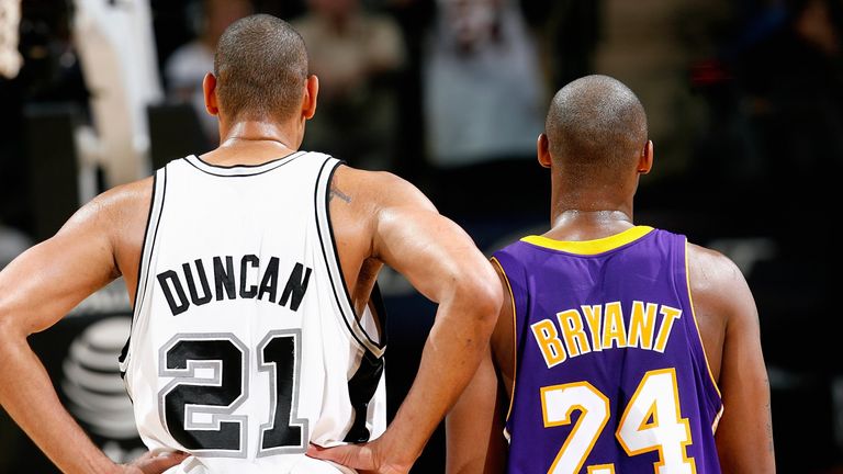 Tim Duncan #21 of the San Antonio Spurs and Kobe Bryant #24 of the Los Angeles Lakers stand together during the game on January 12, 2010 at the AT&T Center in San Antonio, Texas. The Spurs won 105-85