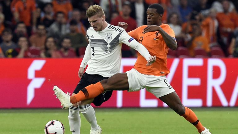 Germany's forward Timo Werner (L) vies with Netherlands' midfielder Georginio Wijnaldum during the UEFA Nations League football match between Netherlands and Germany, on October 13, 2018 at Johan Crujiff ArenA in Amsterdam