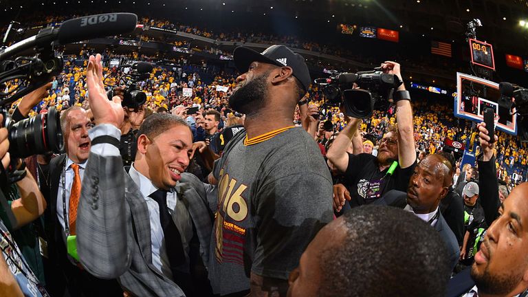 Tyronn Lue celebrates winning the 2016 NBA Finals with LeBron James