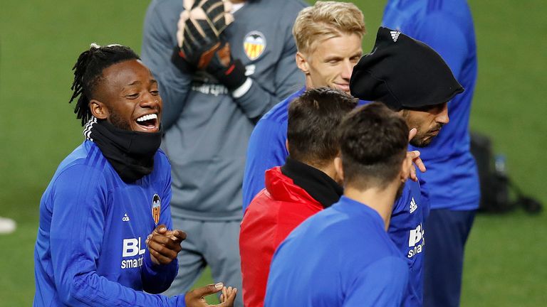 Valencia's Michy Batshuayi shares a laugh with his team mates during training at Old Trafford on Monday night