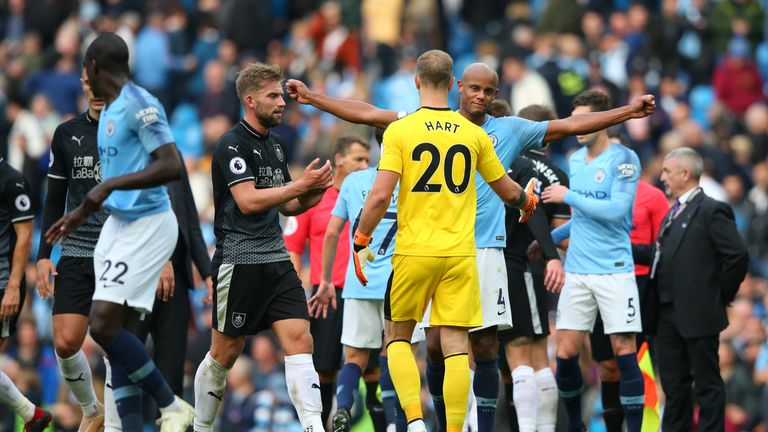 Vincent Kompany and Joe Hart embrace after Man City's 5-0 win over Burnley