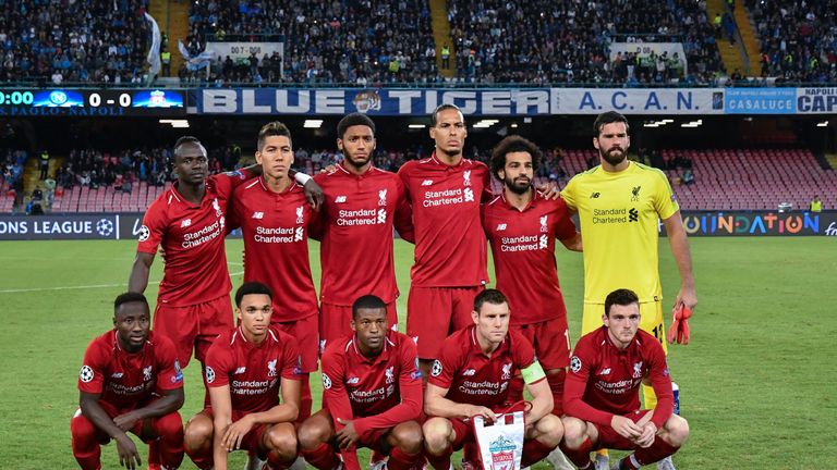 Virgil van Dijk and Mohamed Salah line up prior to Liverpool's UEFA Champions League group match against Napoli in 