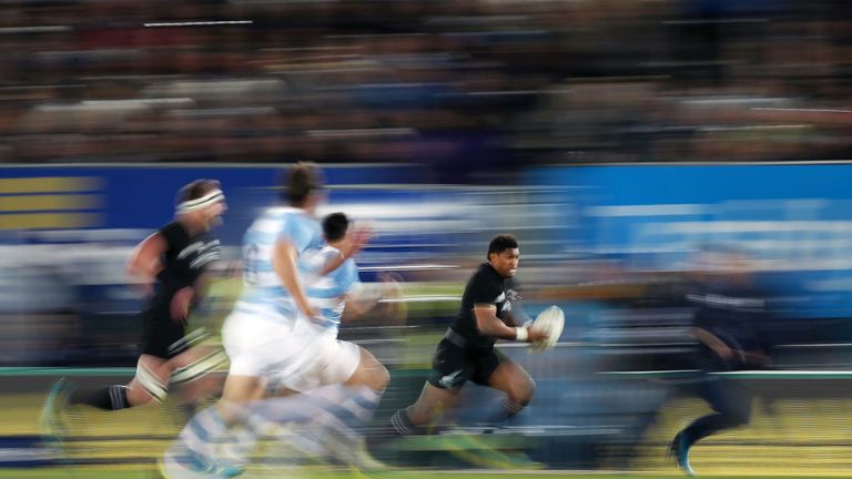 Waisake Naholo of the All Blacks makes a break against Argentina