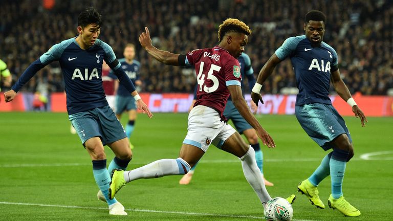 West Ham's Grady Diangana (C) vies with Tottenham Hotspur's Son Heung-Min (L) and Serge Aurier during the Carabao Cup football match at The London Stadium on October 31, 2018