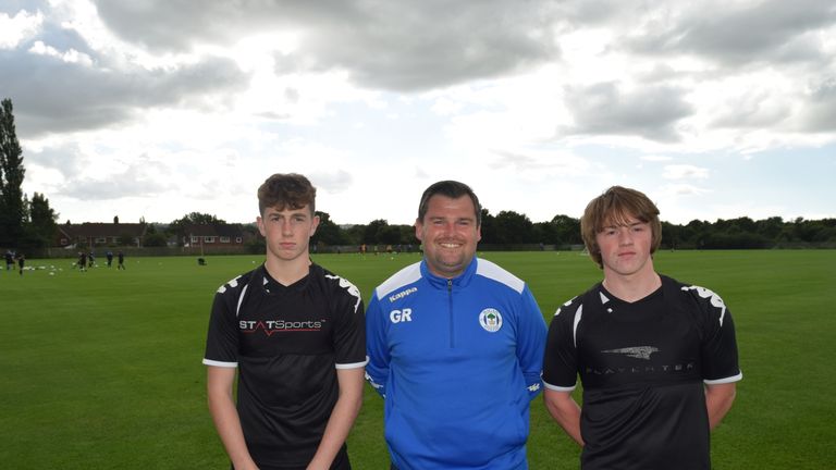Gregor Rioch with young Wigan players Jensen Weir and Joe Gelhardt [Credit: Simon Whitehead, Wigan Athletic]