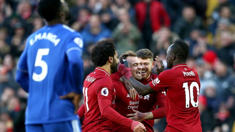 Xherdan Shaqiri celebrates with team-mates after scoring Liverpool's third goal