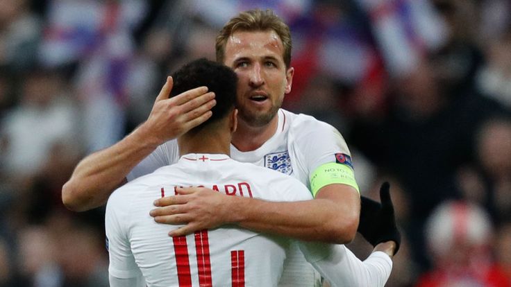Harry Kane embraces fellow goalscorer Jesse Lingard
