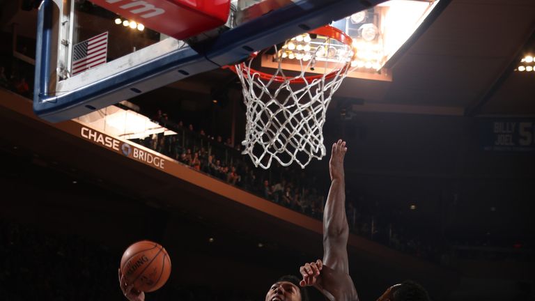 Allozo Trier attacks the rim against Julius Randle