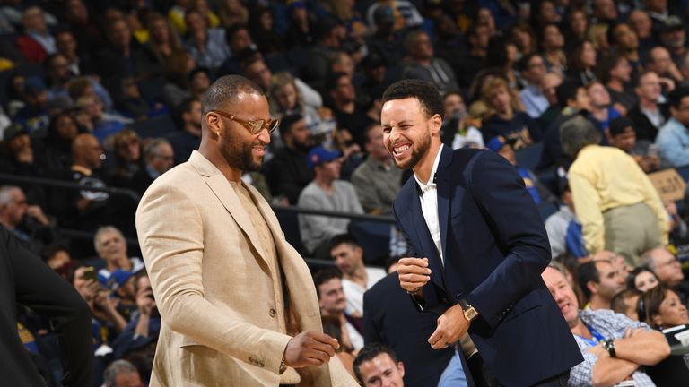 Stephen Curry, on the sidelines with DeMarcus Cousins, has been a big miss for the Warriors