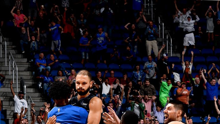 Evan Fournier is mobbed after hitting his game-winning shot