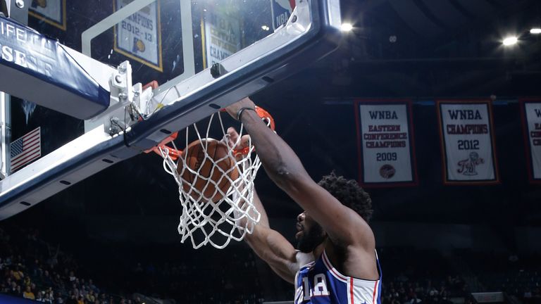 Joel Embiid dunks during the Sixers' win at Indiana