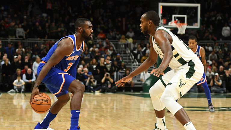 Khris Middleton defends the three-point line against the New York Knicks
