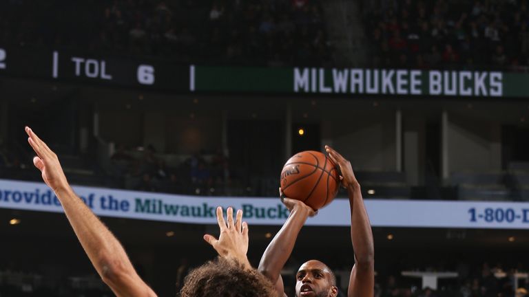 Khris Middleton shoots over Robin Lopez