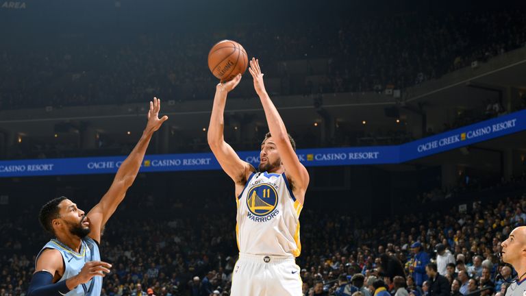 Klay Thompson fires a three-pointer in Golden State's win over Memphis