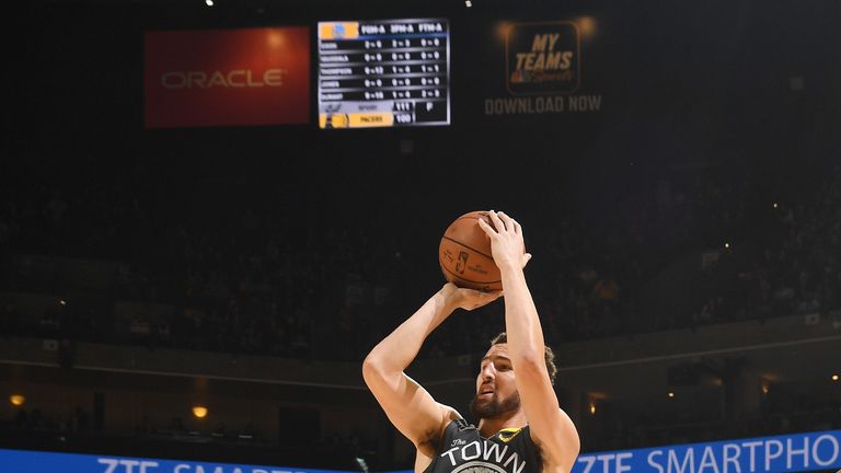 Klay Thompson shoots a jump shot against Portland