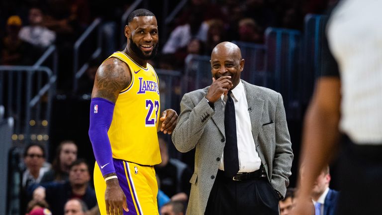 LeBron James shares a joke with Cleveland Cavaliers coach Larry Drew