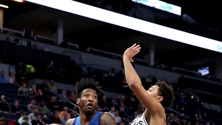 Robert Covington attacks the basket against San Antonio