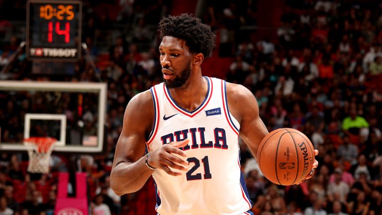 Joel Embiid scored 35 points and grabbed 18 rebounds to help the Philadelphia 76ers defeat the Miami Heat 124-114