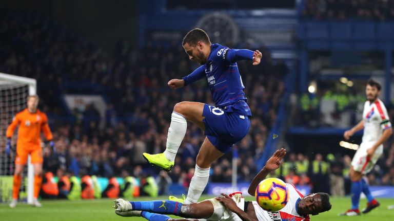 Aaron Wan-Bissaka of Crystal Palace tackles Eden Hazard of Chelsea during the Premier League match between Chelsea FC and Crystal Palace at Stamford Bridge on November 4, 2018 in London, United Kingdom.