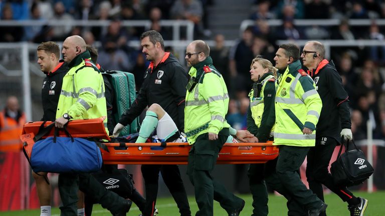 Bournemouth left-back Adam Smith was stretchered off after receiving treatment for eight minutes