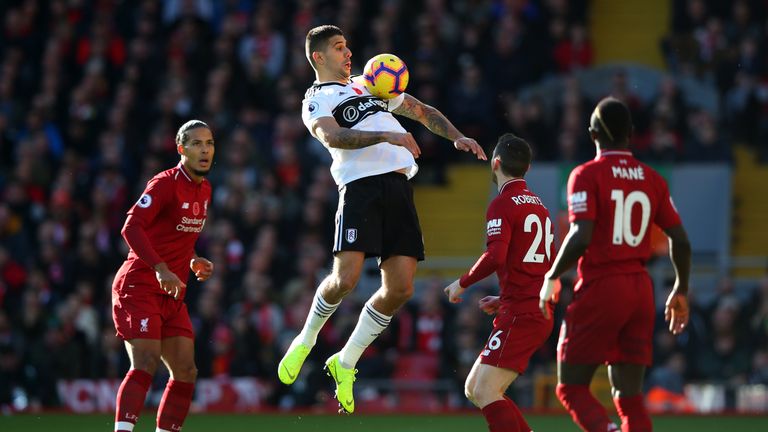Aleksandar Mitrovic controls the ball on his chest during the Premier League match against Liverpool 