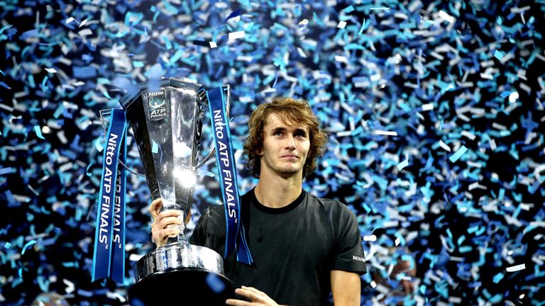 Alexander Zverev of Germany celebrates victory with the trophy following the singles final against Novak Djokovic of Serbia during Day Eight of the Nitto ATP Finals at The O2 Arena on November 18, 2018 in London, England. 