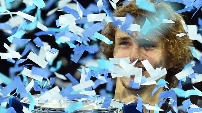 Alexander Zverev is covered in ticker tape after being presented with the trophy after beating Serbia's Novak Djokovic in their men's singles final match on day eight of the ATP World Tour Finals tennis tournament at the O2 Arena in London on November 18, 2018.