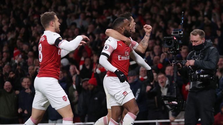 Alexandre Lacazette and Granit Xhaka celebrate the Frenchman's equaliser for Arsenal against Liverpool