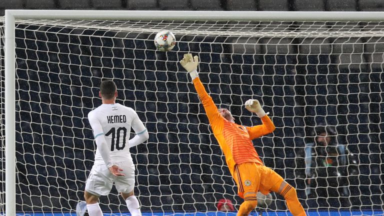 Allan McGregor claws Tomer Hemed's late effort away to safety