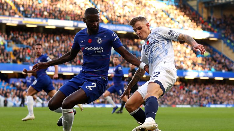 Antonio Rudiger battles for possession with Lucas Digne