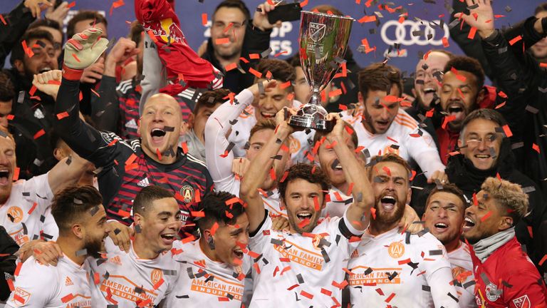 Nov 29, 2018; Harrison, NJ, USA; Atlanta United defender Michael Parkhurst (3) holds up the trophy as the team celebrates after defeating the New York Red Bulls in the MLS Eastern Conference Championship at Red Bull Arena. Mandatory Credit: Brad Penner-USA TODAY Sports