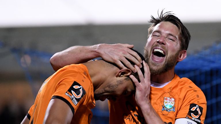 Callum Reynolds of Barnet celebrates with goalscorer Byron Harrison