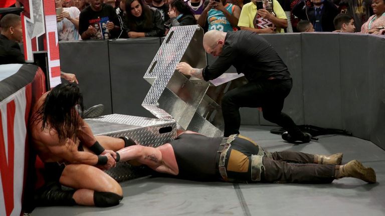 Braun Strowman was left down and out after a savage attack by Baron Corbin and Drew McIntyre