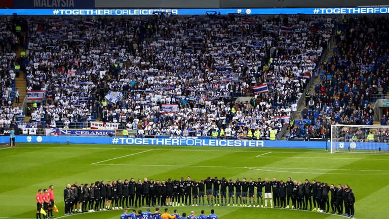 Players line up around the centre circle for a minutes silence for Vichai Srivaddhanaprabha and Armistice day prior to the Premier League match between Cardiff City and Leicester City at Cardiff City Stadium on November 3, 2018 in Cardiff, United Kingdom.