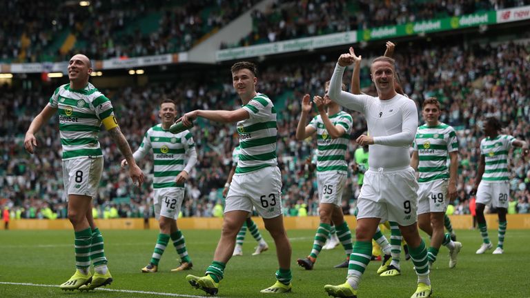 Celtic players celebrate at full time against Rangers